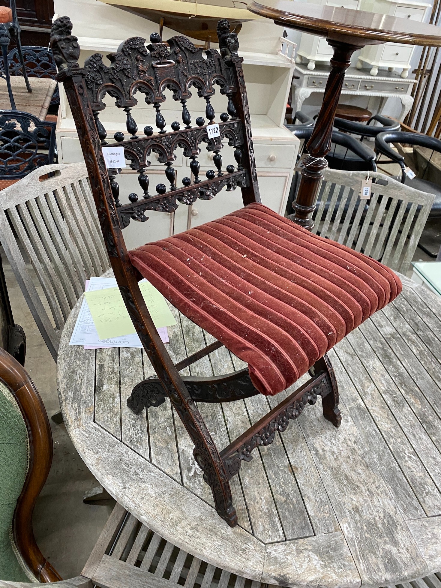 A late 19th century Flemish carved oak folding chair, height 73cm